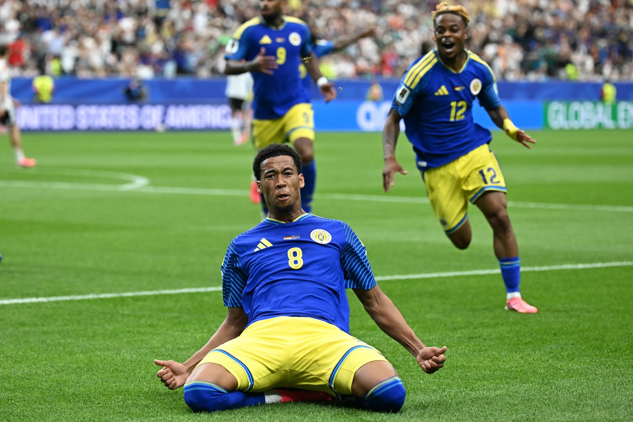 Curacao's midfielder #08 Livano Comenencia celebrates after scoring a goal during the 2026 World Cup Group E football match between Germany and Curacao at the Houston Stadium in Houston on June 14, 2026.  (Photo by Paul ELLIS / AFP via Getty Images)