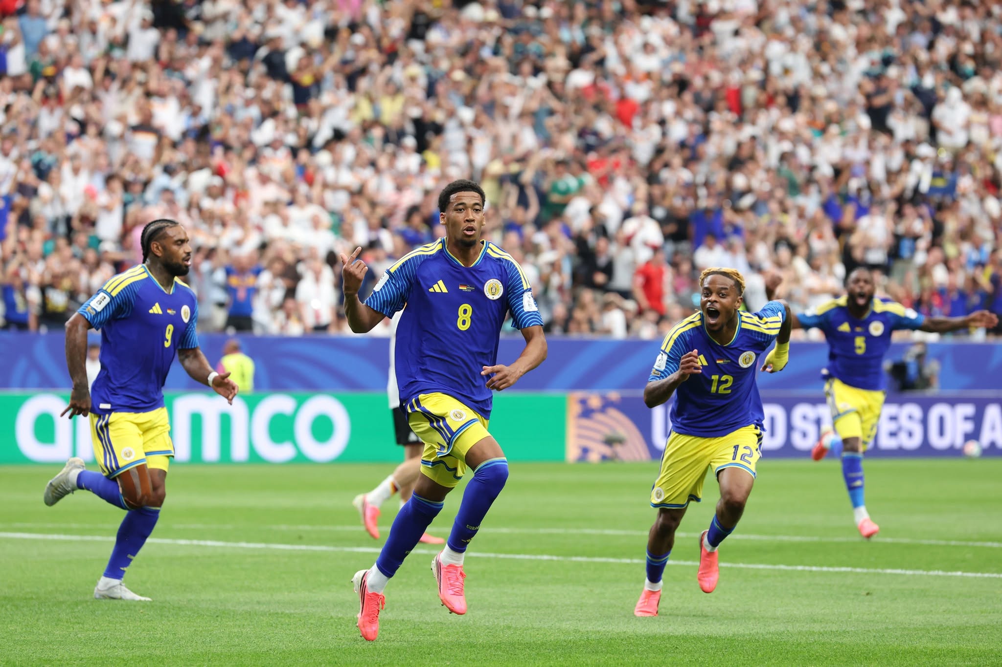 HOUSTON, TEXAS - JUNE 14: Livano Comenencia #8 of Curacao celebrates scoring his team's first goal during the FIFA World Cup 2026 Group E match between Germany and Curacao at Houston Stadium on June 14, 2026 in Houston, Texas. (Photo by Alexander Hassenstein/Getty Images)