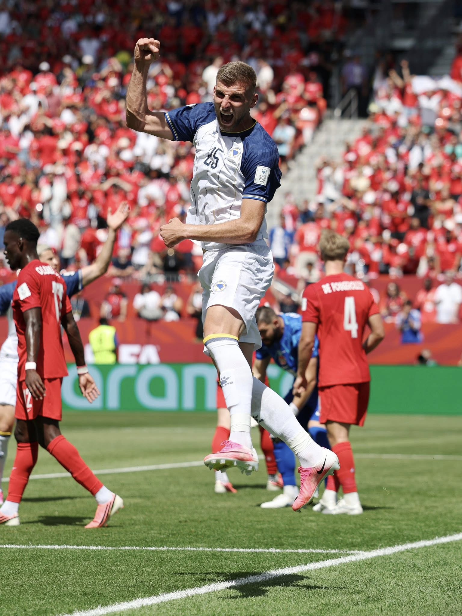 TORONTO, ONTARIO - JUNE 12: Jovo Lukic #25 of Bosnia and Herzegovina celebrates scoring his team's first goal during the FIFA World Cup 2026 Group B match between Canada and Bosnia and Herzegovina at Toronto Stadium on June 12, 2026 in Toronto, Ontario. (Photo by Charlotte Wilson/Getty Images)