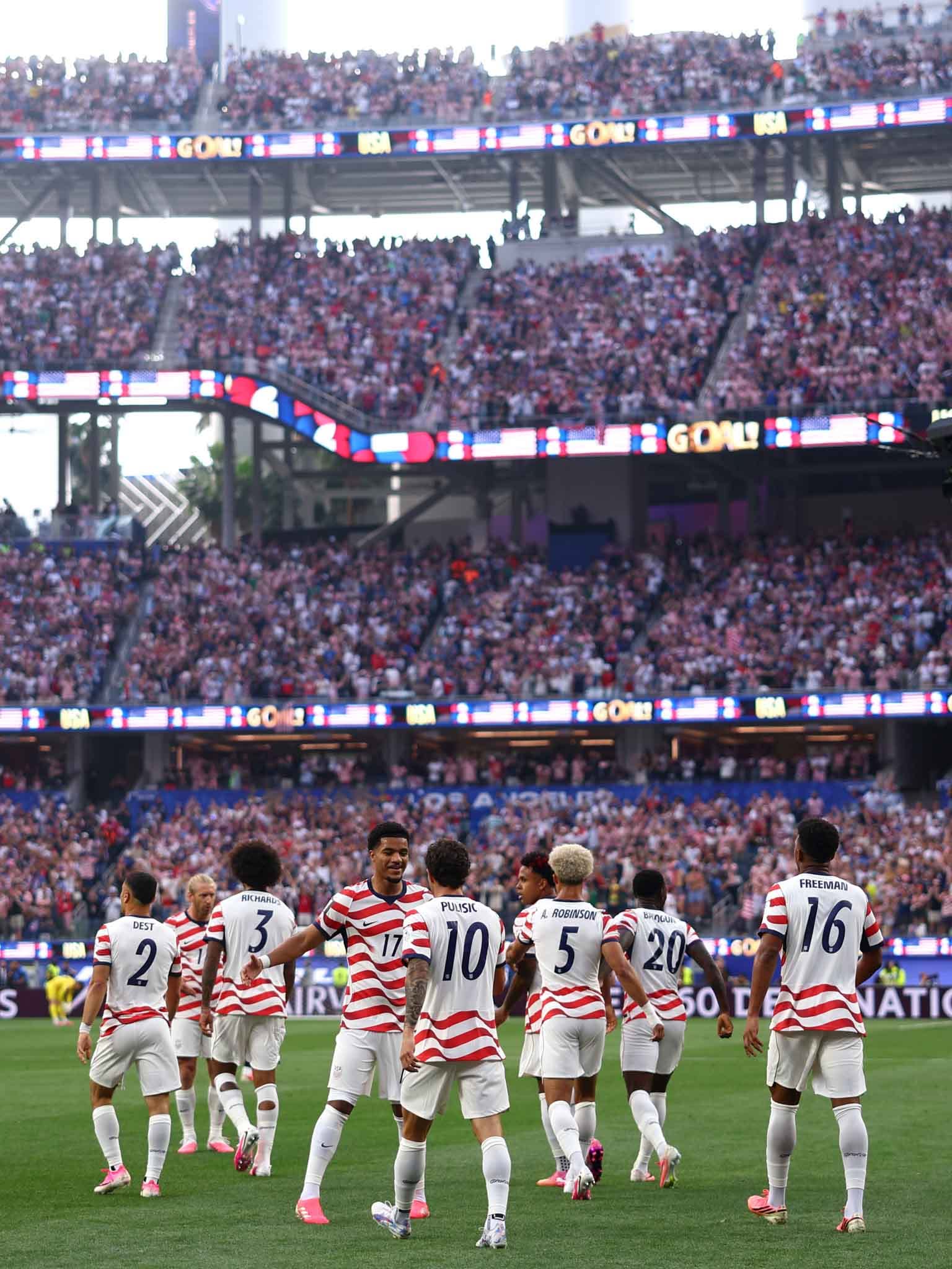 LOS ANGELES, CALIFORNIA - JUNE 12: General view inside the stadium as players of the United States celebrate their side's first goal, an own goal by Damian Bobadilla #16 of Paraguay (not pictured), during the FIFA World Cup 2026 Group D match between USA and Paraguay at Los Angeles Stadium on June 12, 2026 in Los Angeles, California. (Photo by Dean Mouhtaropoulos/Getty Images)