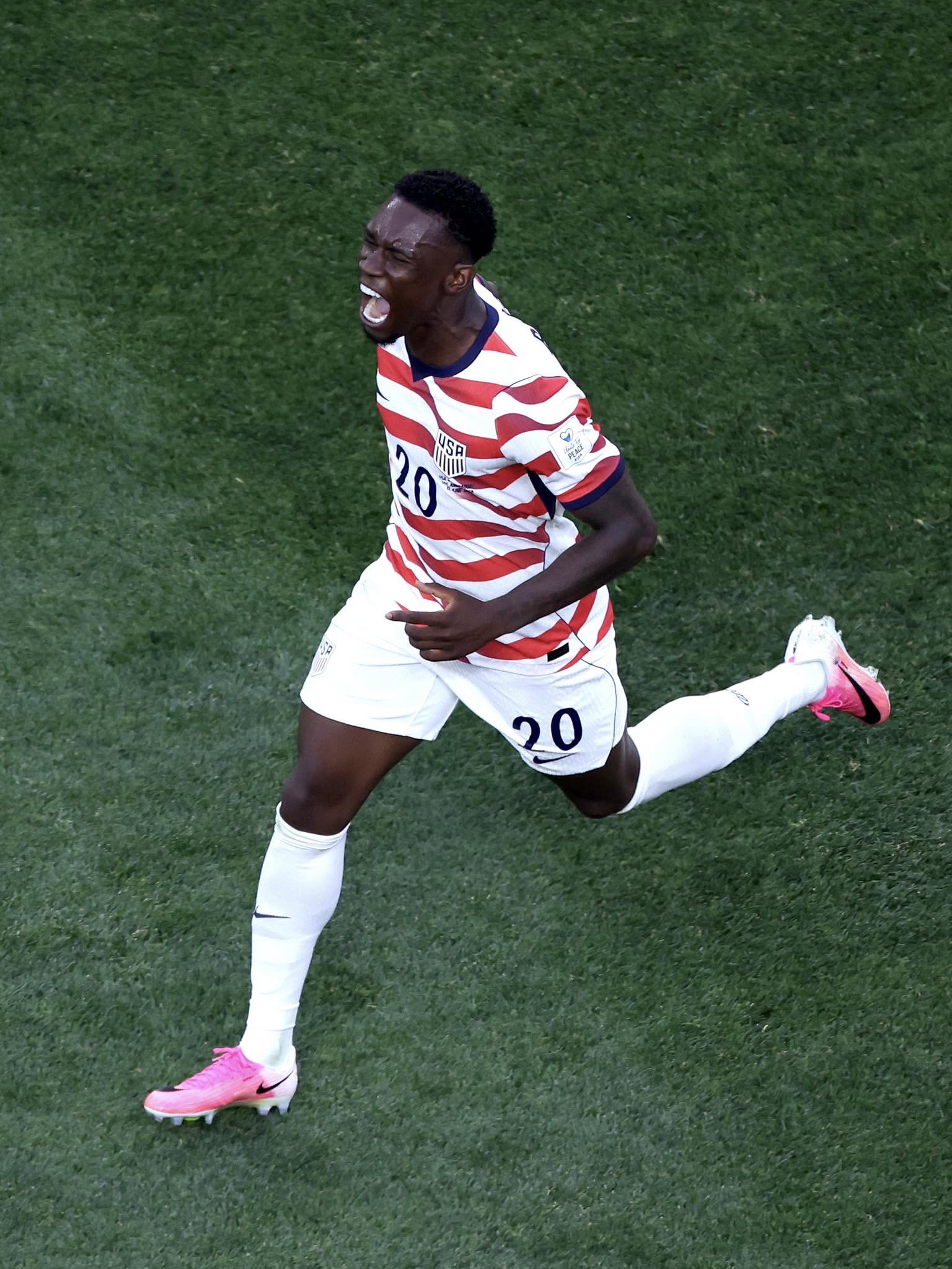 LOS ANGELES, CALIFORNIA - JUNE 12: Folarin Balogun #20 of the United States celebrates scoring his team's second goal during the FIFA World Cup 2026 Group D match between USA and Paraguay at Los Angeles Stadium on June 12, 2026 in Los Angeles, California. (Photo by Harry How/Getty Images)
