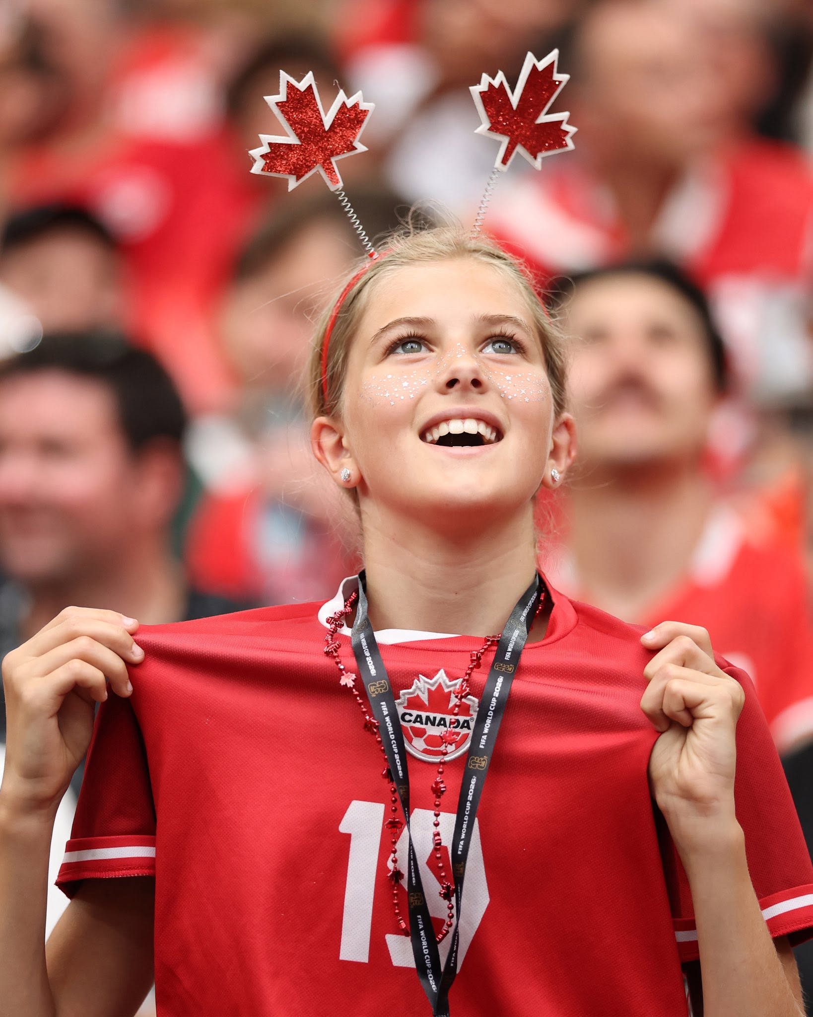 VANCOUVER, BRITISH COLUMBIA - JUNE 24: Promise David #24 of Canada celebrates with teammate Nathan Saliba #25 after scoring his team's first goal during the FIFA World Cup 2026 Group B match between Switzerland and Canada at BC Place Vancouver on June 24, 2026 in Vancouver, British Columbia. (Photo by Jared C. Tilton - FIFA/FIFA via Getty Images)