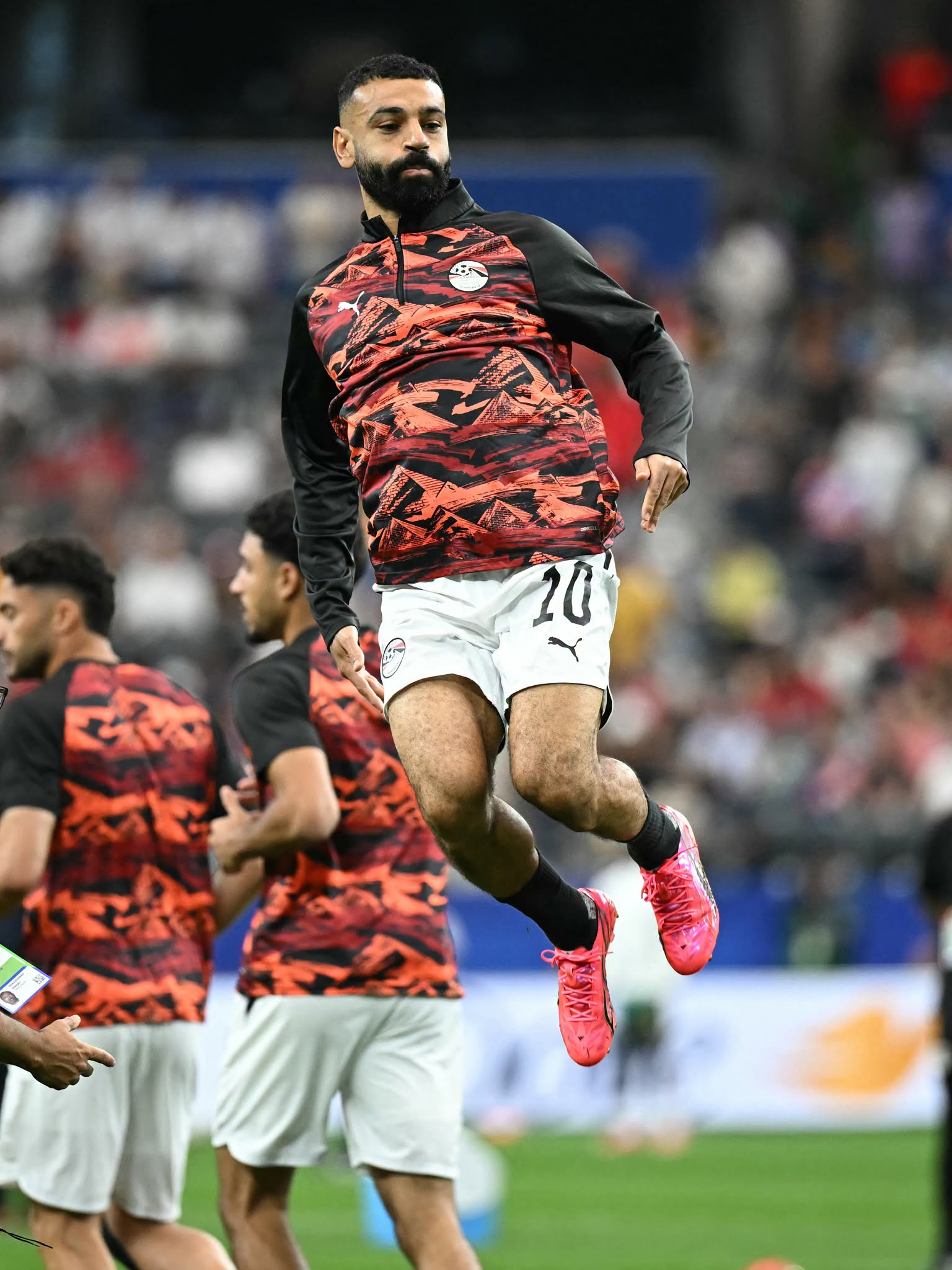 Egypt's forward #10 Mohamed Salah jumps during warm up prior to the 2026 World Cup round of 32 football match between Australia and Egypt at the Dallas Stadium in Arlington on July 3, 2026.  (Photo by Paul ELLIS / AFP via Getty Images)
