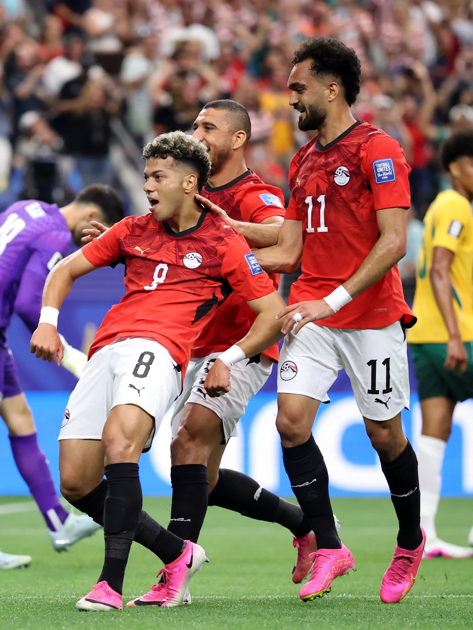 ARLINGTON, TEXAS - JULY 03: Emam Ashour #8 of Egypt celebrates with teammates Ramy Rabia #5 and Mostafa Zico #11 after scoring his team's first goal during the FIFA World Cup 2026 Round of 32 match between Australia and Egypt at Dallas Stadium on July 03, 2026 in Arlington, Texas. (Photo by Hector Vivas - FIFA/FIFA via Getty Images)
