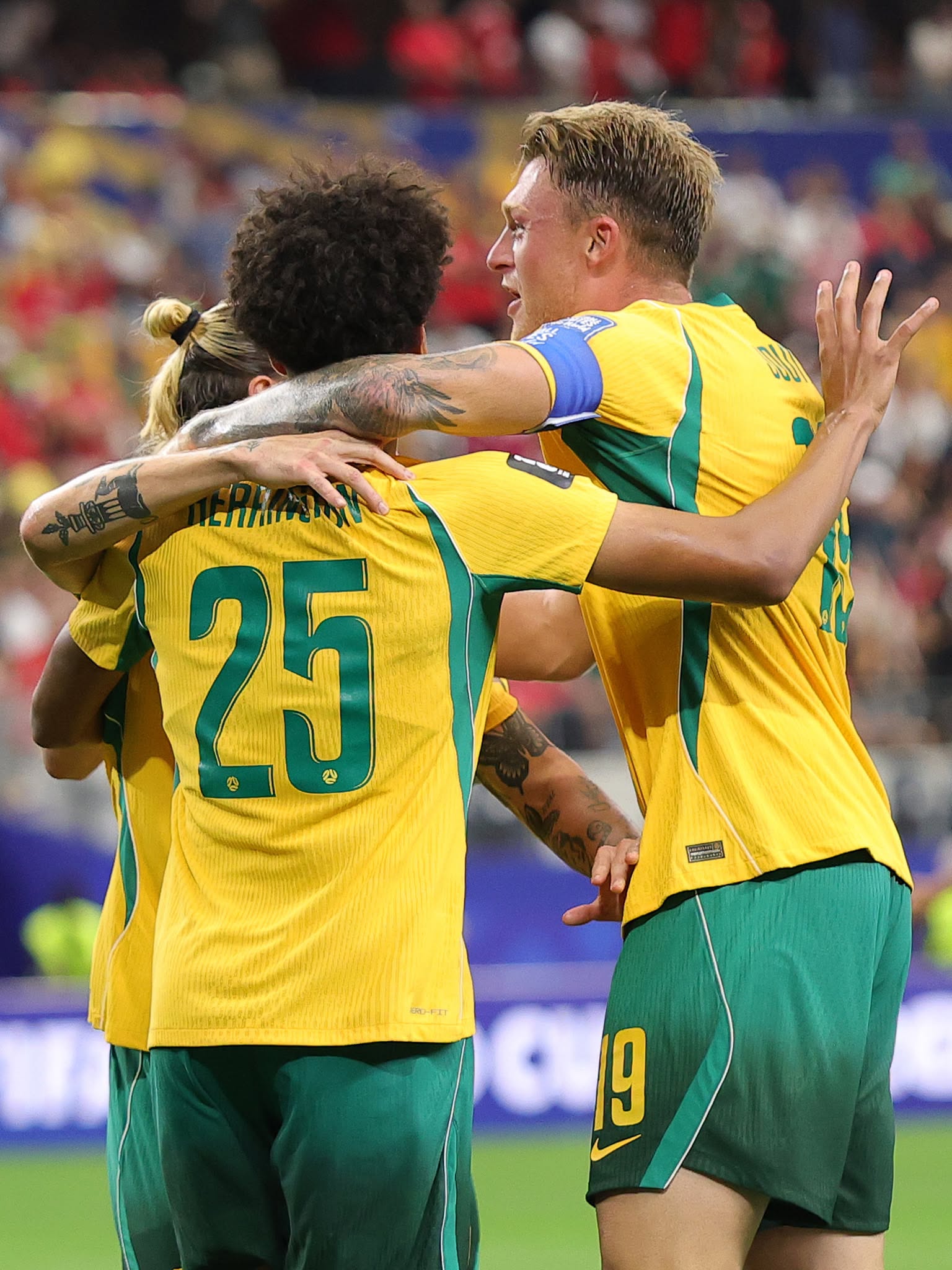 ARLINGTON, TEXAS - JULY 03: Players of Australia celebrate the team's first goal scored an own goal by Mohamed Hany #3 (not pictured) of Egypt during the FIFA World Cup 2026 Round of 32 match between Australia and Egypt at Dallas Stadium on July 03, 2026 in Arlington, Texas. (Photo by Alex Slitz/Getty Images)