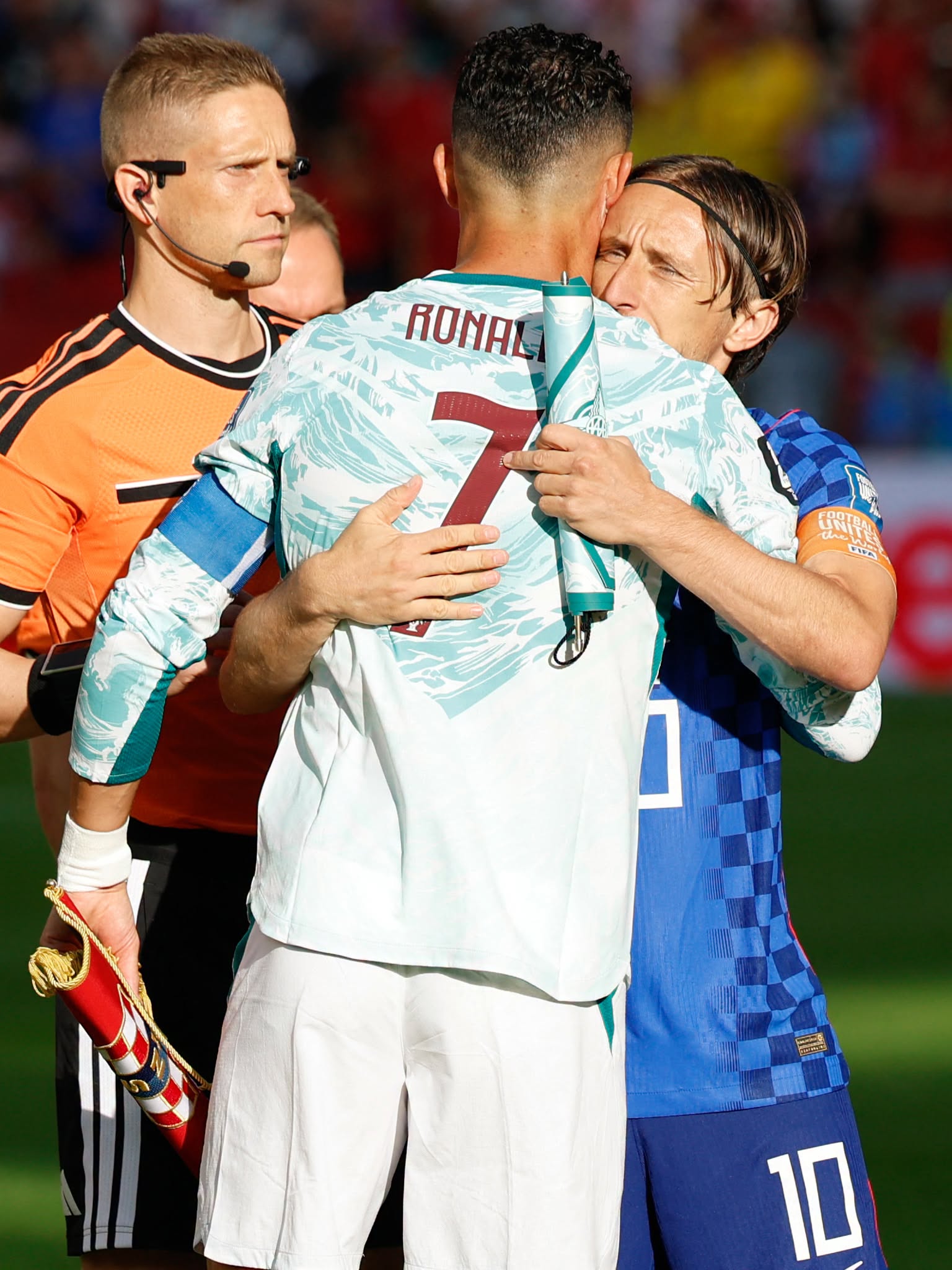 Portugal's forward #07 Cristiano Ronaldo and Croatia's midfielder #10 Luka Modric embrace each other ahead of the 2026 World Cup round of 32 football match between Portugal and Croatia at the Toronto Stadium in Toronto on July 2, 2026.  (Photo by Kamil Krzaczynski / AFP via Getty Images)