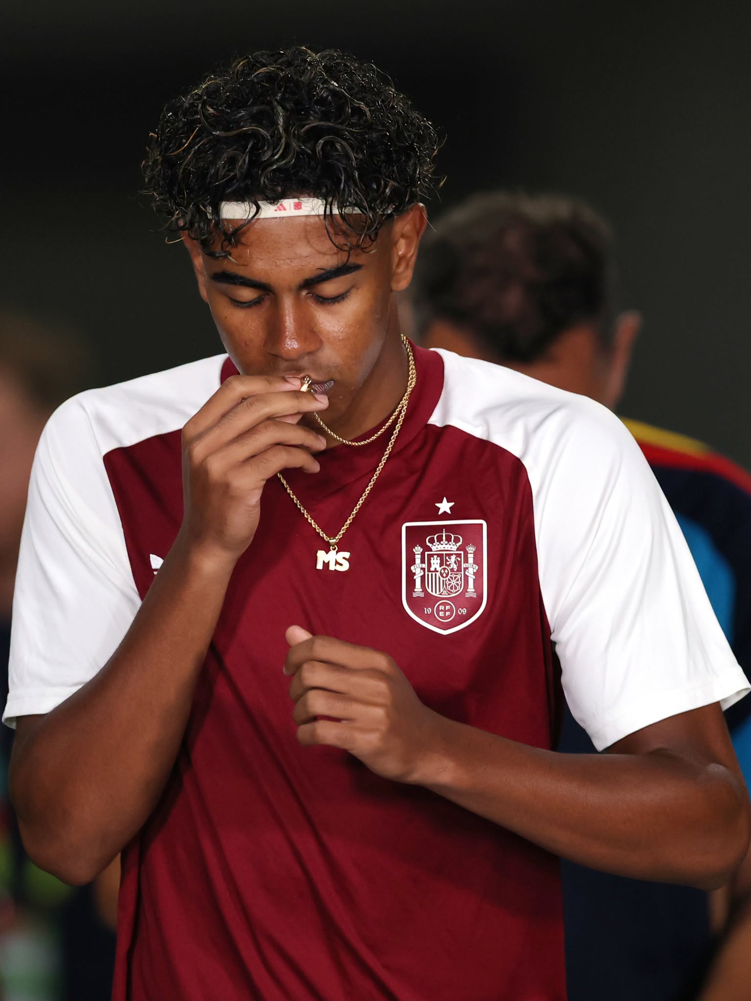 ARLINGTON, TEXAS - JULY 06: Lamine Yamal #19 of Spain kisses his necklace as he walks out the tunnel for the warm up before the FIFA World Cup 2026 Round of 16 match between Portugal and Spain at Dallas Stadium on July 06, 2026 in Arlington, Texas. (Photo by Molly Darlington/Getty Images)