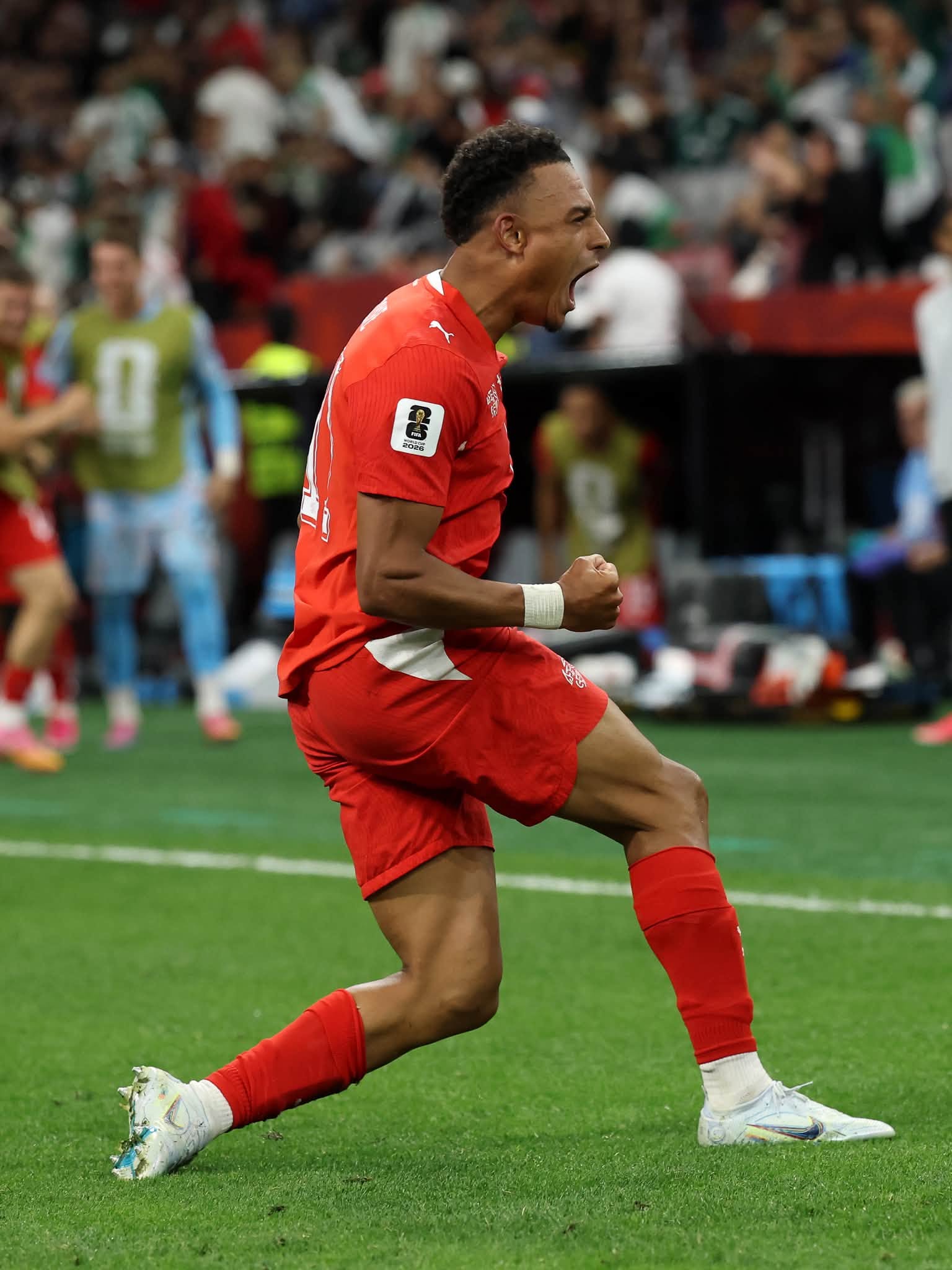 VANCOUVER, BRITISH COLUMBIA - JULY 02: Dan Ndoye #11 of Switzerland celebrates scoring his team's second goal during the FIFA World Cup 2026 Round of 32 match between Switzerland and Algeria at BC Place Vancouver on July 02, 2026 in Vancouver, British Columbia. (Photo by Alex Grimm/Getty Images)